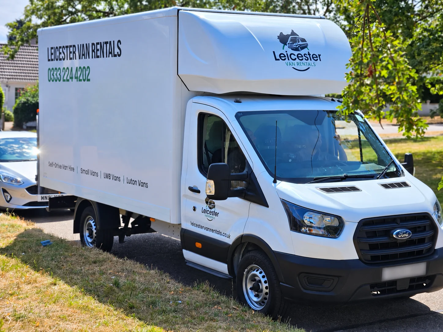 Leicester Van Rentals Ford Transit Luton van parked in Leicester with company branding visible on the vehicle.